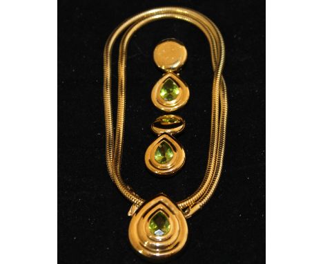 A Boodle & Dunthorne 18ct gold teardrop shaped pendant set with central peridot on a snake type necklace, approx 2 ct, togeth