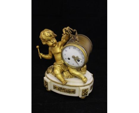 A 19th Century French gilt metal cased mantel clock in the form of a cherub beating a drum, the enamelled dial with Arabic nu