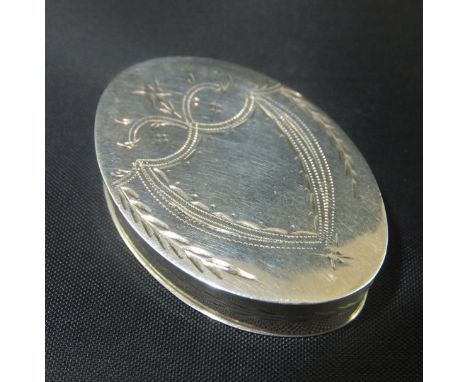 A George III silver patch box of oval form with engaved shield shaped cartouche with wreath to sides and top (by Joseph Taylo