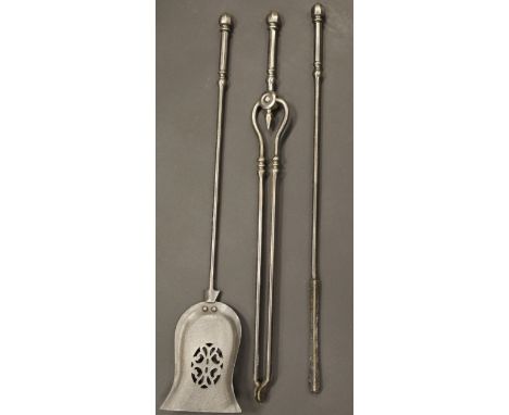 A set of 19th Century iron fireside tools to include shovel, tongs and poker with acorn finials, 76 cm long