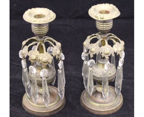 A pair of Victorian brass candle lustres, the reeded sockets with fruit embossed drip pans, the cut glass drops on wild rose 