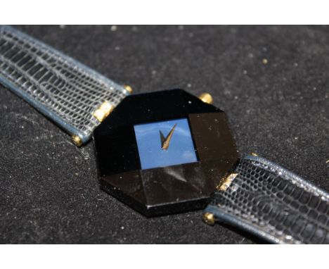 A Century lady's 18ct gold and ceramic mounted mother of pearl faced octagonal wristwatch with two small diamonds to the liza