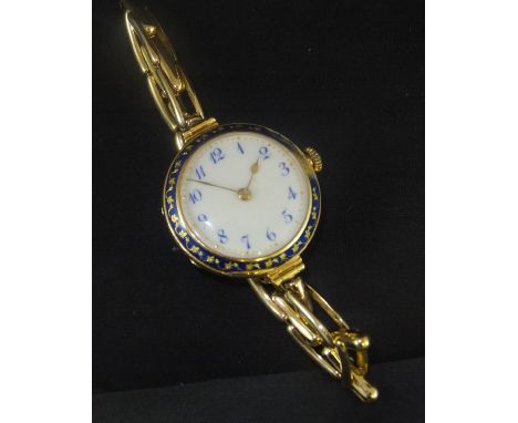 An 18ct gold cased wristwatch by Arnold Lewis of Manchester, with guilloche enamel decorated case, the back set with a solita