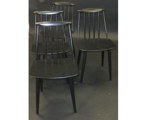 A set of four model J77 black lacquered stick-back kitchen chairs on turned tapering legs designed by Folke Pålsson for FDB M