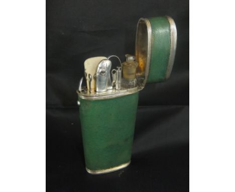 A 19th Century white metal and shagreen mounted etui opening to reveal scent bottle, scissors, spoon, etc., 18.5 cm long COND