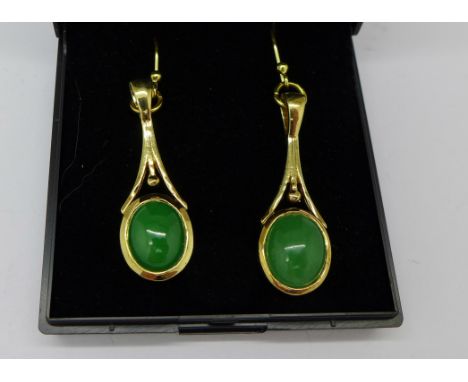 A pair of silver gilt and jade ear drops