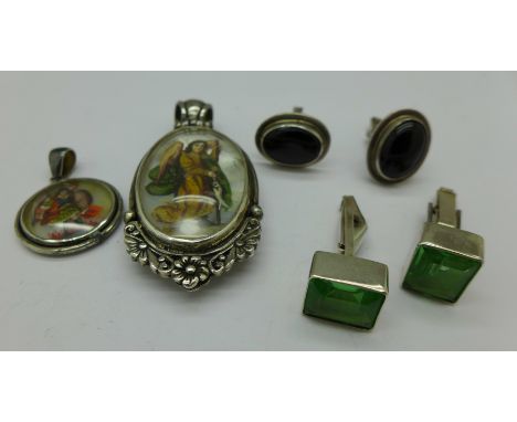 Two pairs of silver cufflinks and two silver pendants