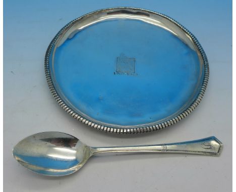 A silver tray marked 925 Sterling and a silver spoon, 110g