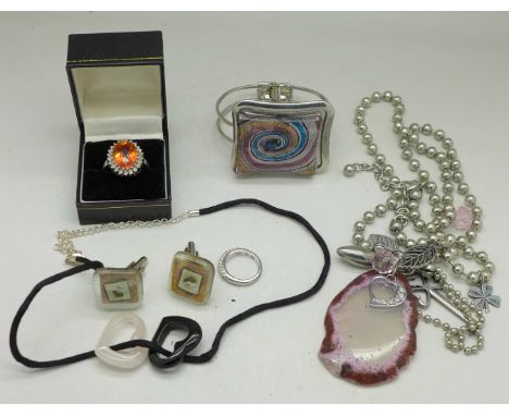 A silver and fire opal ring, one stone missing, a Swarowski crystal ring, a silver mounted hardstone necklace, etc.
