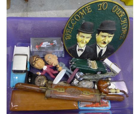 Assorted items; 8 days clock, two novelty wristwatches, model vehicles, carvings, a pipe, two character figures, a bosun's wh