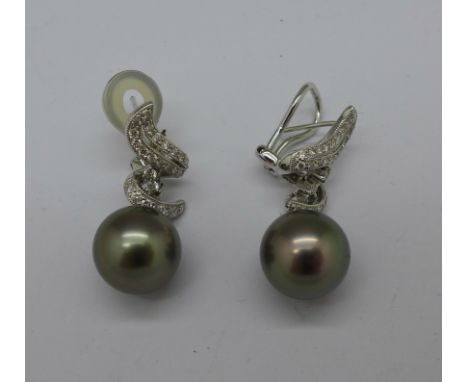A pair of 18ct white gold, 0.64ct diamond and South Sea Island black pearl earrings