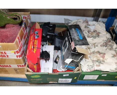 A box containing wireless audio sender, PC accessories, bluetooth speaker, VR headsets etc.