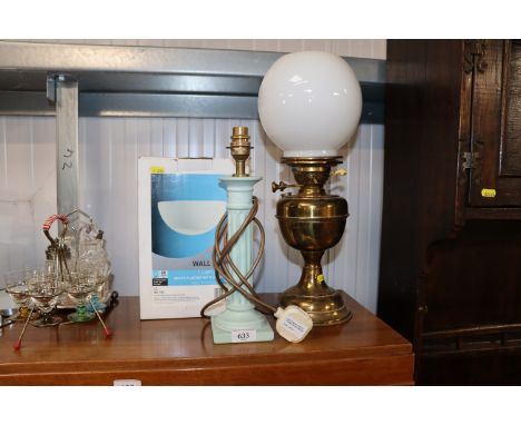 A wall light, a table lamp and an oil lamp converted to electricity