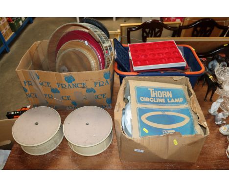 Three boxes containing various display stands; collectors trays; a ceiling lamp etc