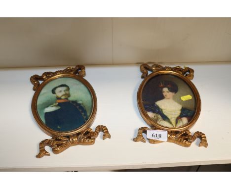 A pair of portrait prints contained in gilt ribbon tied framed