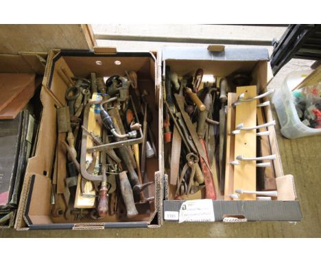 Two tray boxes of various hand tools to include hand braces, hand saws, spanners, files, two wall mounting coat racks etc.