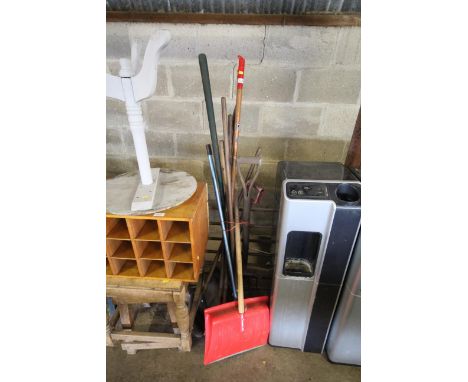 A quantity of long handled gardening tools to include snow shovel, brooms etc.