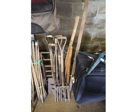 A quantity of gardening tools to include spades, fork, scythe etc.