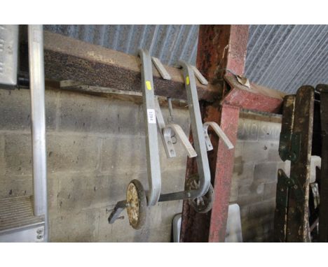 Two ladder roofing attachments