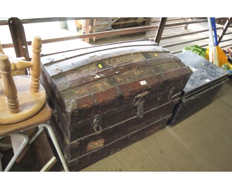 A wood and metal bound travelling trunk