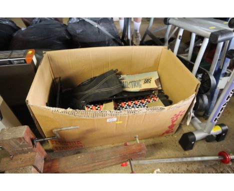 A box containing various Scalextric track