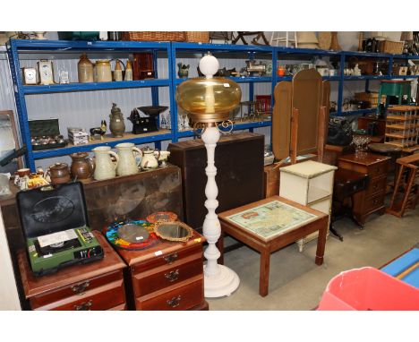 A turned wooden lamp base and glass shade