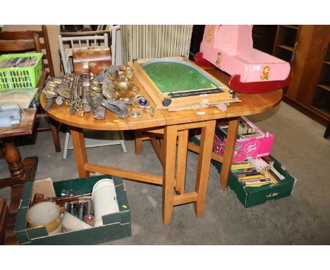 A modern hardwood gate leg table