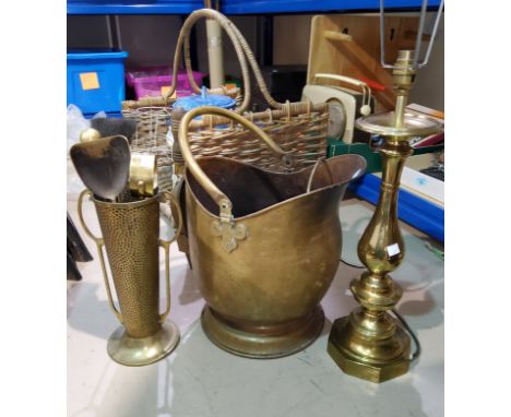 A brass coal helmet and companion set; a large brass table lamp; a log basket; etc. 