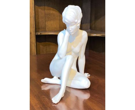 A continental parianware ceramic figure of a resting female nude, Kaiser, W. Germany.&nbsp; A little dusty, but otherwise in 