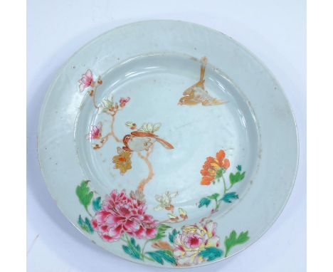 A 19th century Chinese famille rose dish decorated with flowers, a bird on branch and one in flight, d.23cm 2 chips and rim f