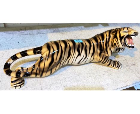 A large ceramic Soviet era Eastern European tiger in repose, (1 tooth a.f.), length 64cm and two blue and white vases 