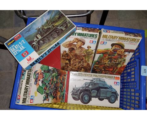 Three originally boxed sets of Tamiya Military Miniatures, German Machine Gun Troops, U.S Combat Group set, British Eight Arm