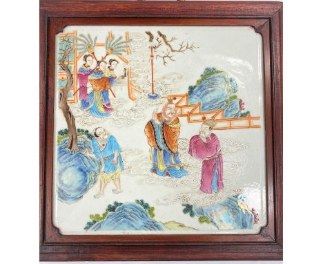 A Chinese ceramic polychrome decorated tile/plaque in stained wood frame with brass handle depicting a scene of three men and