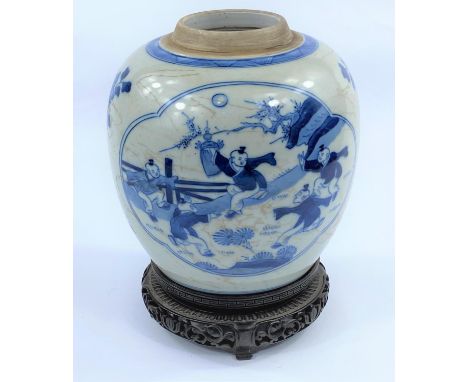 A Chinese blue and white ceramic ginger jar, decorated with panels to either side, one of children playing, one with young ma