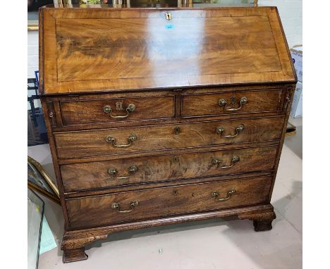 A Georgian inlaid figured mahogany bureau with fall front, fitted interior, 3 long and 2 short drawers, on ogee bracket feet,