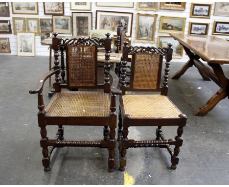 A set of eight Tudor style dining chairs with canework seats and back panels on 'bobbin' turned H stretcher supports - 6 plus