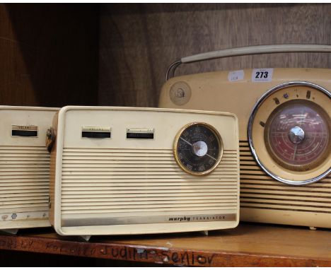 A mid century Bush portable radio in cream Bakelite together with two early plastic transistor radios by Murphy plus a Bakeli