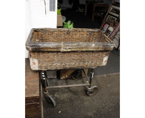 A vintage  Wicker orchard basket on wheels