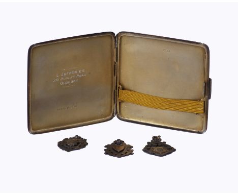 A sterling silver cigarette case  with engine turned decoration together with three silver watch fobs. 