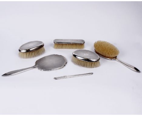 A sterling silver dressing table set with engine turned decoration. 