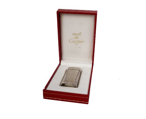 A Cartier white metal lighter. Stamped Cartier Paris E41285. In original Must de Cartier red leather box. 