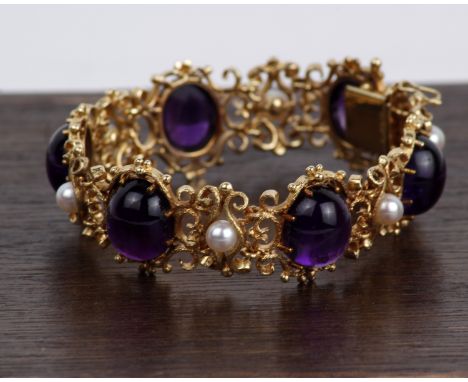 A 14k gold pearl and Amethyst open work bracelet. 42g 