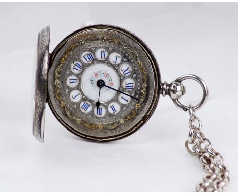 A sterling silver ladies open faced key wind pocket watch. Gilt and enamel face with roman numeral markers on a white metal c