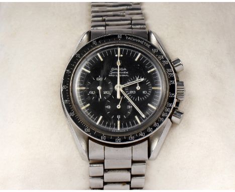 An Omega Speedmaster professional moon chronograph gentleman's wristwatch. Black face with luminous baton markers. 3 subsidia