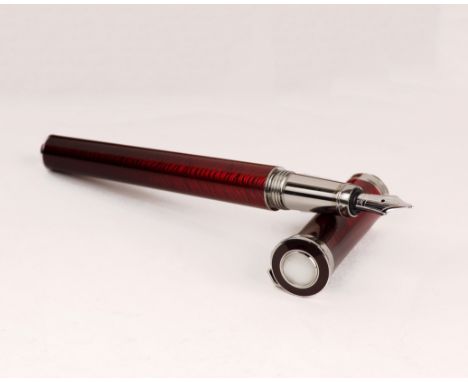 A Cartier red enamel fountain pen. Boxed. 