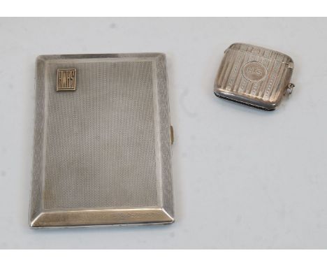 A silver rectangular cigarette case, Chester, 1929, Asprey & Co Ltd., with engine turned decoration within a Greek key border