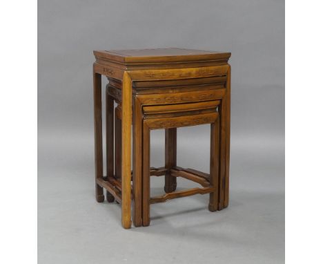 A Chinese hardwood nest of three bow front tables, 20th century, 60cm high, 44cm wide, 35cm deep (3)light scratches all over,