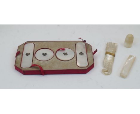 A group of mother-of-pearl object of vertu, 19th century, comprising: a cased set of gaming counters marked hearts and clubs 