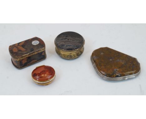 A group of four gilt-brass agate boxes, early 20th century, comprising: a circular snuff box with embossed c-scroll sides, 5.