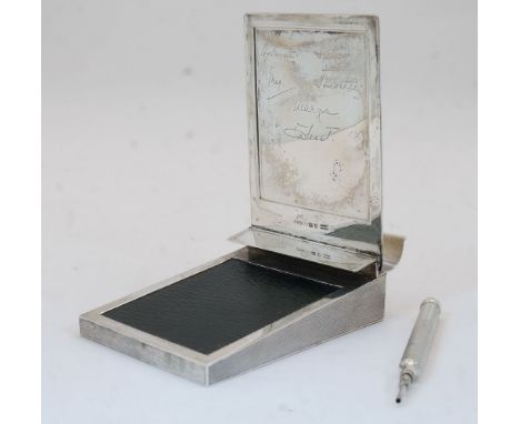 A George V desk note pad holder, London, circa 1930s, Asprey & Co Ltd, the engine-turned case with hinged lid with six facsim